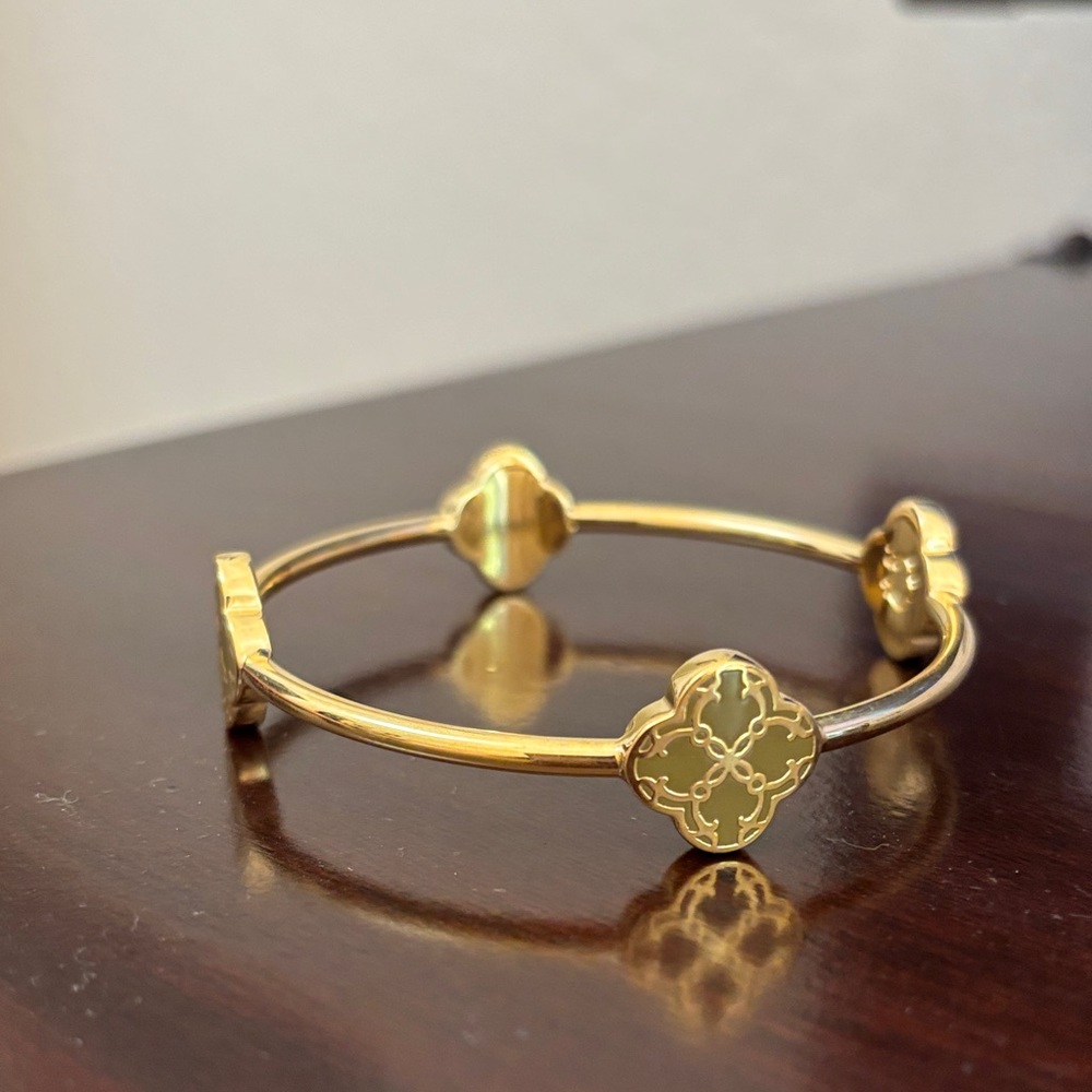 C. Wonder Gold Bracelet with olive green clover accents.